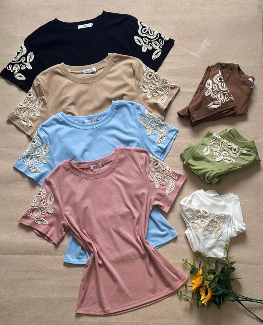 Blusa de algodón bordado en la manga